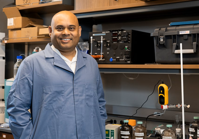 Meenesh Singh, standing in his lab (Photo: Jenny Fontaine/UIC)