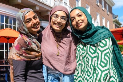 three women smiling at the Illini Union