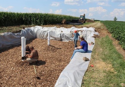 A woodchip bioreactor is being installed at a University of Illinois research farm.