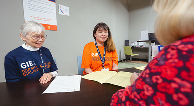 VITA Volunteers talking to taxpayer